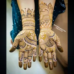 A full-palm design featuring a peacock on one hand and a floral cuff on the other, with covered fingertips for a dark stain.