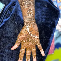 Look at the incredible progress. This intricate hand design, complete with a peacock motif, was created by a student after taking my course, showcasing their newfound skill in detailed work.