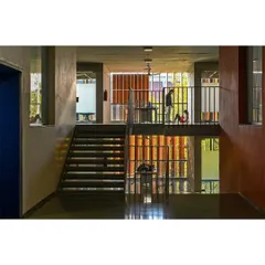 Multi-level circulation spaces within the School of Arts and Sciences are designed to be active social zones. The interplay of stairs, bridges, and open corridors creates visual connections between floors, promoting a sense of community and shared academic purpose.