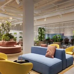 This is a design concept for a vibrant breakout area in a large coworking project. The goal was to create an inviting, energetic space using plush, colorful seating and abundant greenery, making it the perfect spot for both creative brainstorming and relaxed conversation.