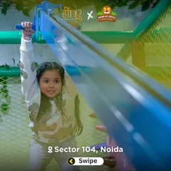 This girl is enjoying our zipline, a thrilling ride that lets kids fly over the play area. It's a safe and supervised activity that always gets a great reaction.