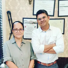 With Dr. Joken Bam, a respected colleague and scientist. It's an honor to collaborate with and treat professionals from around the world.