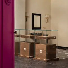 Behind these vibrant fuschia doors in a luxury tiles showroom lies an exclusive private viewing space for Versace’s exquisite tile collection. We designed this room to be a visual feast of opulence and elegance, set in a mesmerizing environment.