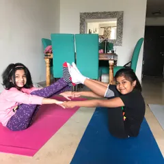 Partner yoga is a favorite among the kids. This partner boat pose helps them learn to work together, communicate, and build friendship while having a great time.