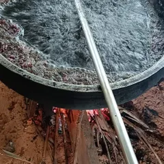Here you can see our hair oil being prepared the traditional way, in a bronze uruli over a wood fire. This slow cooking process takes two days and helps infuse all the goodness of the herbs into the oil, which is what makes it so effective.