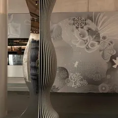A sculptural totem from the 'Silver Escapade' installation. Its form is a mix of period-inspired ornate shapes and modern, clean lines, reflecting the theme of blurring time.