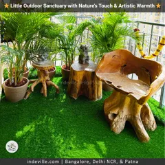 This balcony is a sanctuary of art and nature. I used a handcrafted, sculptural wooden chair and side tables to create a rustic and artistic focal point amidst the greenery.
