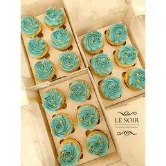 Simple, elegant, and perfect for a large event. These are classic vanilla cupcakes topped with beautiful teal buttercream rosettes and a sprinkle of tiny gold stars for a celestial touch.