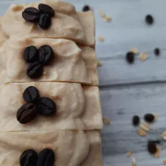 This stack of Scrubby Coffee soaps shows the creamy, oat milk-infused top layer. This soap provides a vigorous scrub that leaves your skin feeling incredibly smooth.