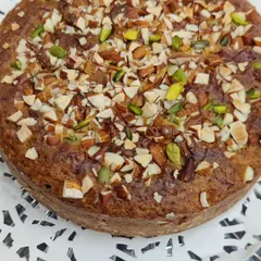 Our Saffron Almond Tea Cake is a perfect accompaniment to your evening tea. This eggless cake is infused with the delicate flavour of saffron and topped with crunchy sliced almonds and pistachios.