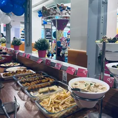 I make sure the party food is a highlight. This buffet setup shows the variety I offer, from kid-friendly french fries to savory paneer skewers and a creamy mushroom soup for the adults to enjoy.