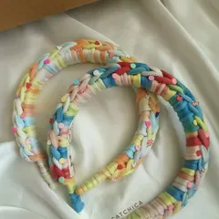 Our Princess Braids headbands are a bestseller for a reason! They are trendy, colorful, and comfortable, inspired by Disney fashion. This pair shows our popular beachy and rainbow colorways.