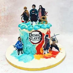 A full view of our Demon Slayer cake, showcasing the iconic logo and multiple characters including Tanjiro and Nezuko.