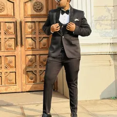 I believe the groom should look just as sharp. This classic black tuxedo is tailored to perfection, ensuring a dapper and timeless look for any pre-wedding shoot or formal event.