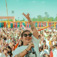 Leading a massive crowd at a Holi festival in Ranchi. I love the energy of outdoor events, connecting with thousands of people through a mix of high-energy Bollywood and Punjabi beats.