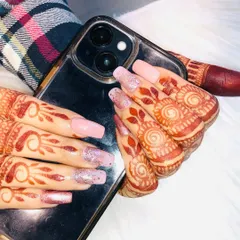 Here is the same bridal mehendi and nail art set in a more natural pose. It shows how the complete look comes together beautifully for photos and everyday moments during your celebrations.