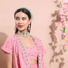 This look features a beautiful pink ethnic co-ord set. I styled it with the same statement jewelry and floral headband to create a cohesive story across different outfits in the collection.