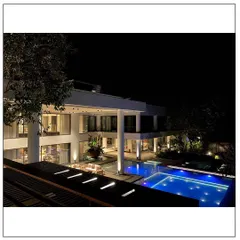 We designed this courtyard-style house in the coastal town of Alibaug to be a modern home engulfed by botanical landscaping. The strategic lighting transforms the space at night, highlighting the pool and creating an easy-going overtone that is perfect for relaxation.