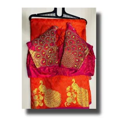 I offer a range of silk sarees with heavily embroidered designer blouses. This vibrant red saree comes with a matching blouse featuring an intricate peacock feather design on the sleeves, so you get a complete, ready-to-wear look.