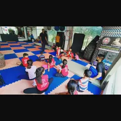 A typical scene from one of my kids' classes. We always start with a group warm-up and discussion before getting into the day's drills.