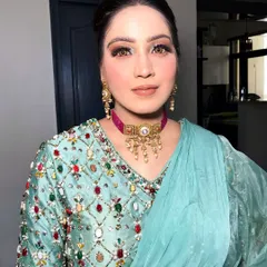 Serving up some serious glam with a powder blue twist. This look features a colorful matte eye and glossy lips, perfect for a cocktail party or sangeet.