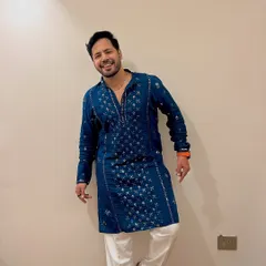 Day 3 Navratri style. A deep blue embroidered kurta paired with white pants. A classic, festive look that's both stylish and comfortable for a long night of hosting.