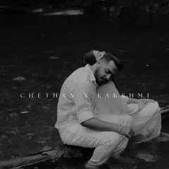A quiet, soulful moment captured in black and white. The couple sits by the water, lost in their own world. This artistic shot focuses on emotion and the serene, moody atmosphere of the location.