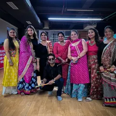 Our happy students posing with their dandiya sticks after a successful workshop. We provide all the necessary props for an authentic experience.