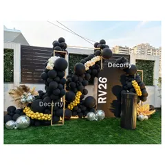 I designed this modern and stylish photo backdrop for a 26th birthday with a 'Disco Night' theme. The custom signage, dramatic black and gold balloon arrangement, and disco ball accents create the perfect spot for memorable party pictures.