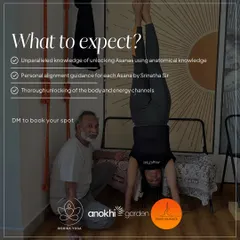 A student practices a handstand against the wall with guidance from Srinatha Sir. This image details what to expect from his workshops: personal alignment guidance and a thorough unlocking of the body's energy channels.