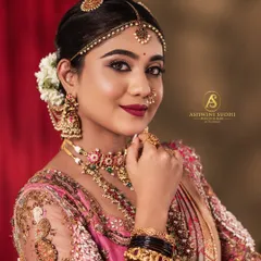 The glow of a bride is truly special. For this shot, I focused on capturing a candid, happy expression, highlighting the vibrant makeup and the traditional jewelry that completes the Muhurtham look.