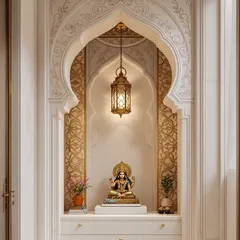 A traditional and ornate pooja space set within a beautifully carved arch. The intricate details and warm lighting create a truly divine atmosphere.