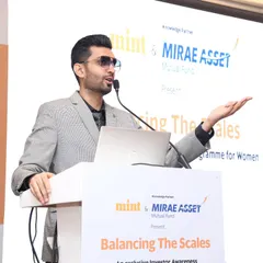 On the podium for the Mirae Asset and HT Mint 'Balancing The Scales' event. I bring a polished and professional presence to financial summits, ensuring the program is both informative and engaging.