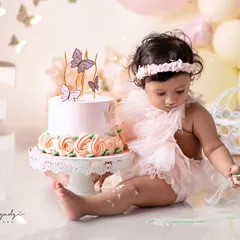 Turning one in style! This beautiful angel is enjoying her butterfly-themed cake smash. I am a big fan of these sessions, they are so colorful and cute.