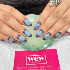 A moody and beautiful aura nail design. This look features a deep purple to light blue gradient, creating a soft, airbrushed effect that is both trendy and unique.