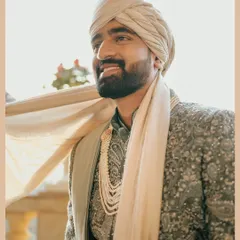 A sun-kissed portrait of the groom, Ritesh. The golden light and his happy expression perfectly capture the joy of his wedding day.