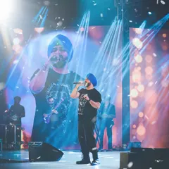 Manmeet Singh owning the stage at Miss Navi Mumbai 2025. I use dramatic lighting and wide angles to capture the scale and energy of a live musical performance.