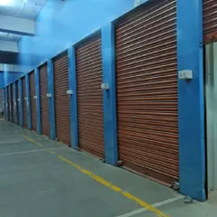 This is a look at our individual, private storage units. Each unit features a secure rolling shutter and is housed within our clean, professionally maintained facility, ensuring your items are protected and accessible only to you.
