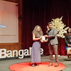 I feel so grateful for this moment, receiving a token of appreciation on the TEDx IIM Bangalore stage. It was an honor to contribute to such an inspiring event filled with eminent speakers and powerful ideas.