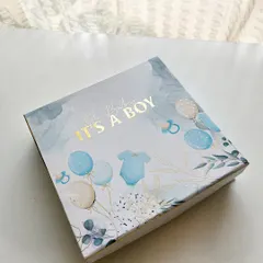 A beautiful 'It's a Boy' gift box with a watercolor design, perfect for filling with chocolates or other sweet treats to announce your new baby.