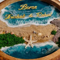The golden acrylic names stand out beautifully against the deep blue of the resin ocean. This piece is fully personalized for the Borse family.
