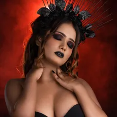 Another angle of the gothic queen concept, highlighting the contouring and the dramatic interplay of light and shadow. The black lipstick and smoky eyes create a cohesive, high-impact look.