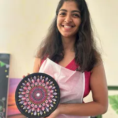 Look at that proud smile. This participant is holding her finished Dot Mandala plate, a beautiful and intricate piece she created dot by dot in one of my adult workshops.
