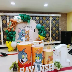 A classic Tom and Jerry themed party for Sayansh's first birthday. The setup includes a custom backdrop and themed pedestals featuring the iconic cartoon duo.