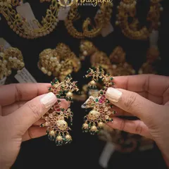 Another beautiful pair of ear cuffs, this time with multi-color stones in a peacock design. These are perfect for adding a pop of color to your festive outfits.