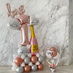 A perfect duo for a first anniversary celebration. I paired a large, custom balloon arrangement with one of my signature hot air balloon gifts, which held fresh flowers and chocolates.