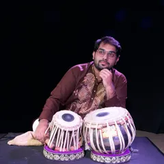 Lost in thought with my tabla. Each performance is an opportunity to capture the beauty of life, one rhythm at a time, and share that feeling with the audience.