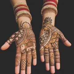 This design showcases two of my favorite traditional motifs: the royal elephant and the graceful peacock. The hands feature different but complementary patterns, a popular choice for guests at weddings.