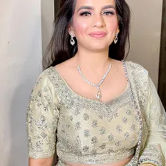 A close-up of the sweetest bride-to-be, Deepti, for her sagan. We kept the makeup clean and luminous, with a soft pink lip and simple eye makeup.
