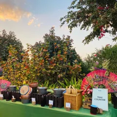 We create immersive culinary experiences like this dedicated Thai Counter. The setup is decorated with thematic elements like traditional fans and bamboo steamers, transporting guests with authentic flavors and ambiance.